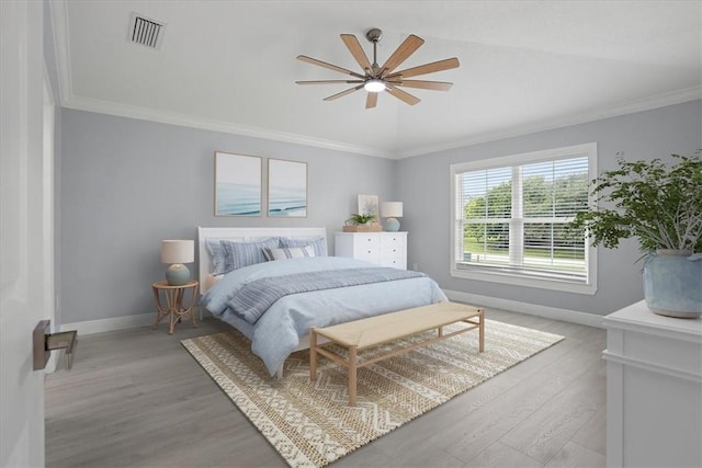 614 Stevenson Ave, Sebastian, FL 32958 - bedroom with light wood-type flooring, ornamental molding, and ceiling fan