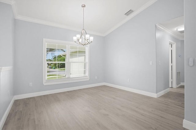614 Stevenson Ave, Sebastian, FL 32958 - empty room with light wood finished floors, a chandelier, and crown molding