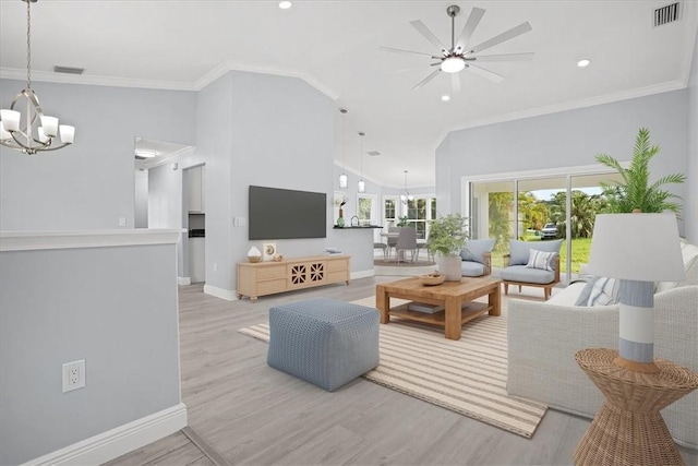 614 Stevenson Ave, Sebastian, FL 32958 - living area with a chandelier, ceiling fan, wood finished floors, crown molding, and recessed lighting