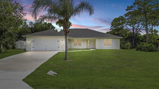 614 Stevenson Ave, Sebastian, FL 32958 - single story home featuring concrete driveway, a front yard, a garage, and stucco siding