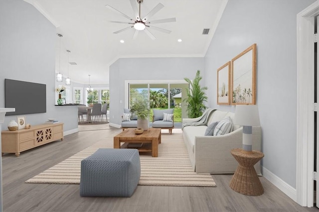 614 Stevenson Ave, Sebastian, FL 32958 - living room with ceiling fan, wood finished floors, ornamental molding, and recessed lighting