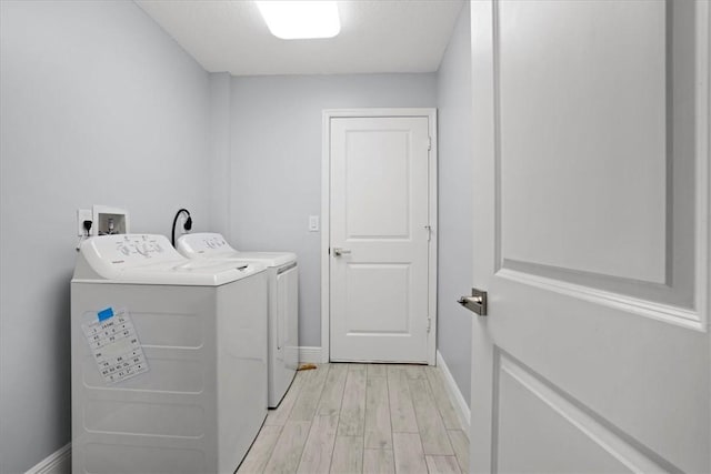614 Stevenson Ave, Sebastian, FL 32958 - washroom with separate washer and dryer and light wood-type flooring