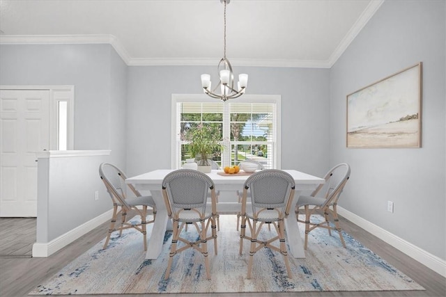 614 Stevenson Ave, Sebastian, FL 32958 - dining area featuring a chandelier, ornamental molding, and wood finished floors