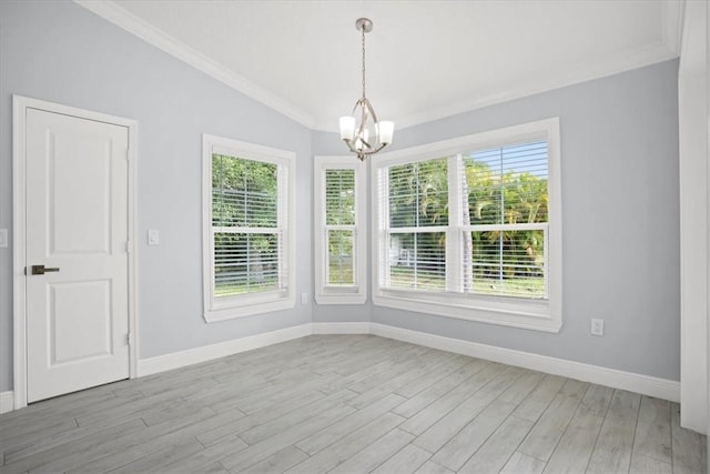 614 Stevenson Ave, Sebastian, FL 32958 - unfurnished dining area featuring a chandelier, crown molding, light wood finished floors, and lofted ceiling