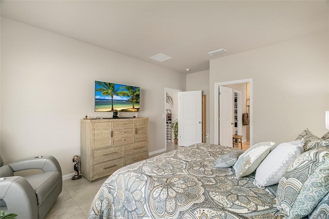 bedroom featuring light tile patterned floors and baseboards