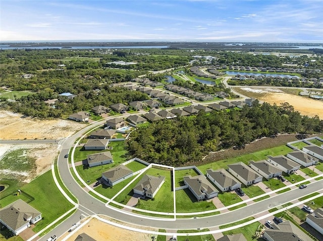 aerial view with a residential view and a water view