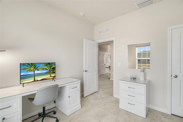 office space with visible vents and baseboards