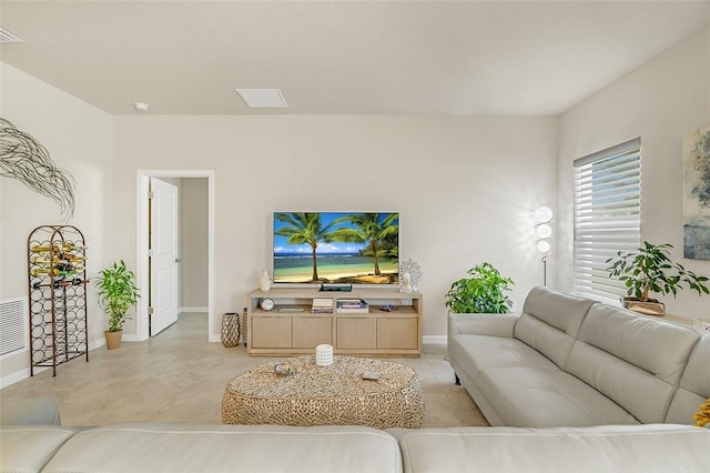 living area featuring visible vents and baseboards