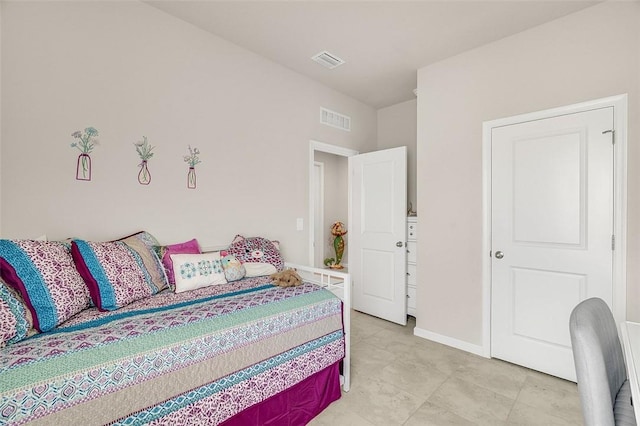 bedroom featuring visible vents and baseboards