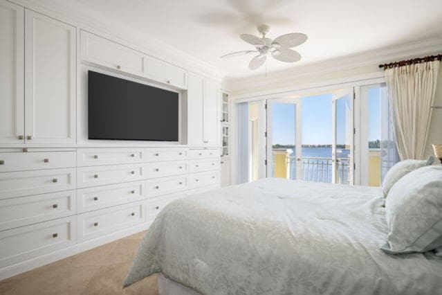 bedroom featuring ceiling fan, access to exterior, and crown molding