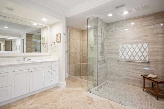 full bath with visible vents, a stall shower, ornamental molding, recessed lighting, and vanity