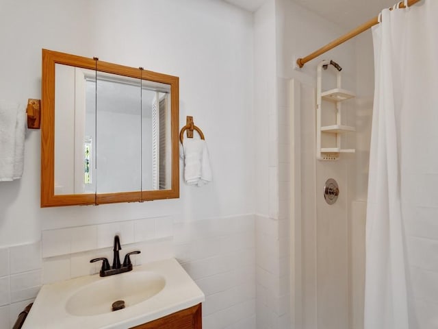 bathroom with vanity and a shower with shower curtain