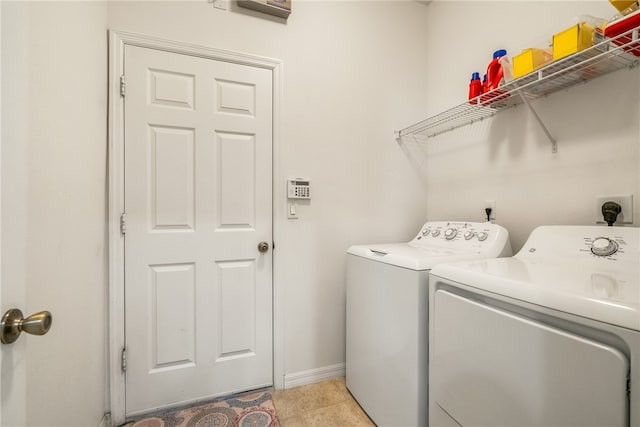 washroom with light tile patterned floors and independent washer and dryer