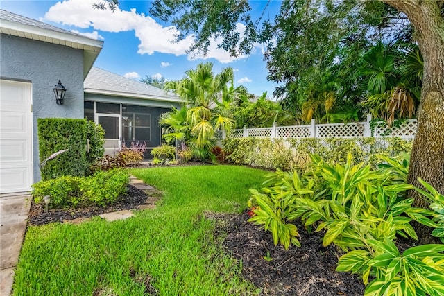 view of yard featuring a sunroom