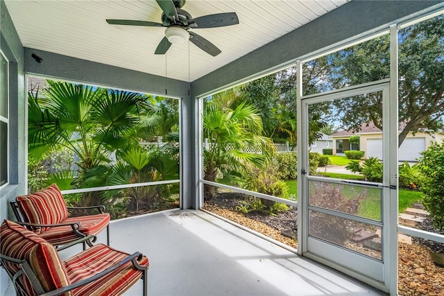 sunroom / solarium with ceiling fan and plenty of natural light