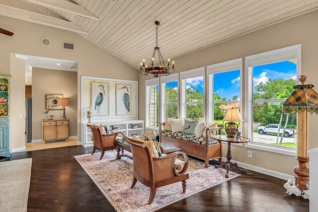 sunroom with a chandelier, vaulted ceiling, wooden ceiling, and plenty of natural light