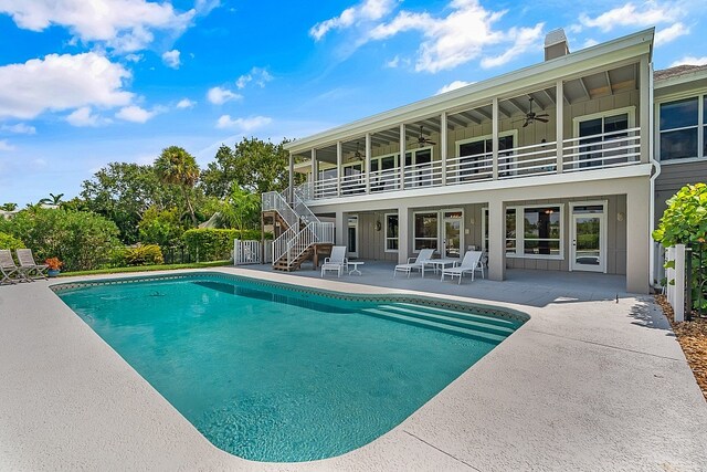 view of pool featuring a patio area and ceiling fan