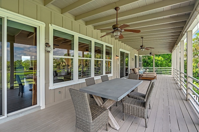 wooden deck featuring ceiling fan