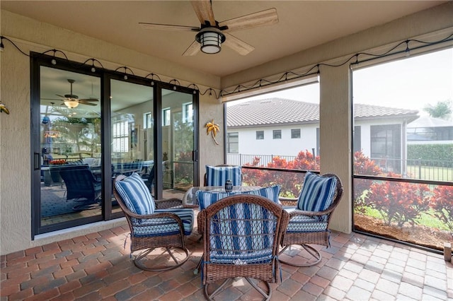 sunroom / solarium with ceiling fan and plenty of natural light