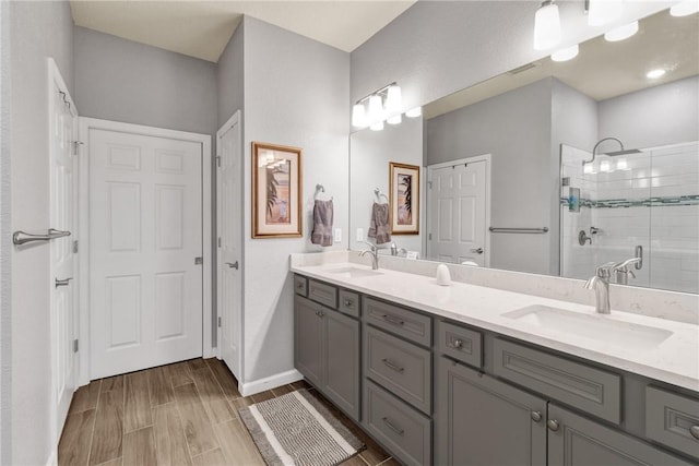 bathroom featuring vanity and a shower with shower door