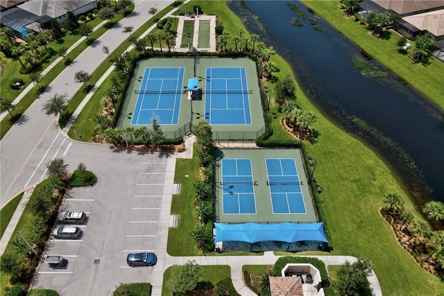 birds eye view of property with a water view