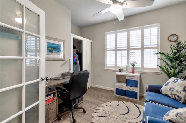 office space featuring french doors and ceiling fan