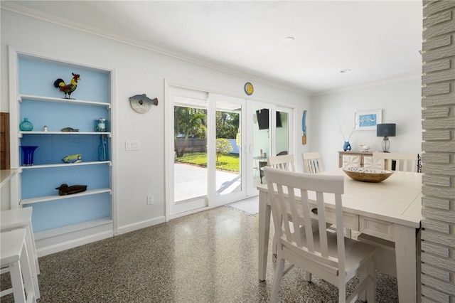 dining space featuring french doors and crown molding