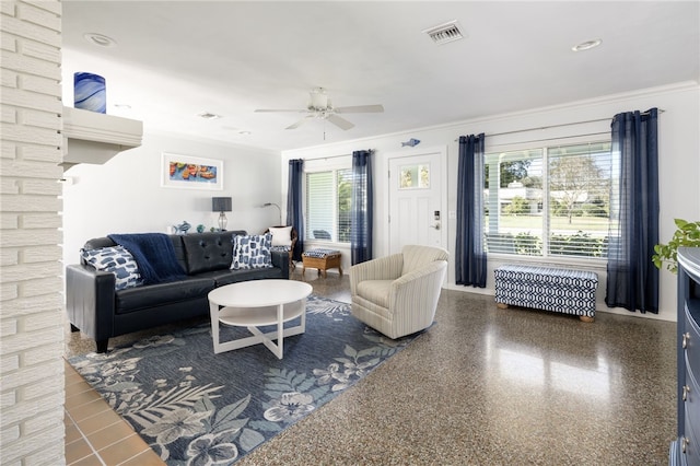 living room featuring ceiling fan and ornamental molding