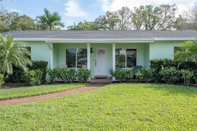 ranch-style home with a front yard