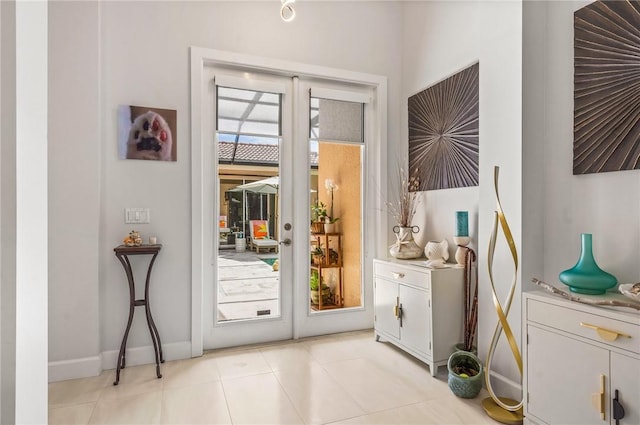 doorway featuring french doors and light tile patterned flooring