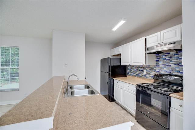 kitchen with black appliances, under cabinet range hood, white cabinets, and a sink