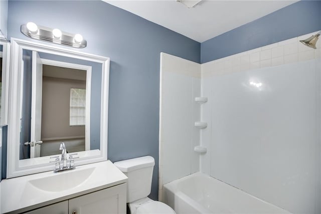 full bathroom featuring shower / bath combination, vanity, and toilet