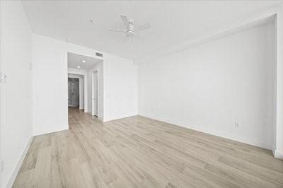 225 Strand Dr Unit 204, Melbourne Beach, FL 32951 - spare room with light wood-style flooring and a ceiling fan