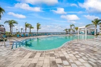 225 Strand Dr Unit 204, Melbourne Beach, FL 32951 - community pool featuring a patio