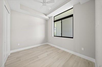225 Strand Dr Unit 204, Melbourne Beach, FL 32951 - spare room with light wood-type flooring and a ceiling fan