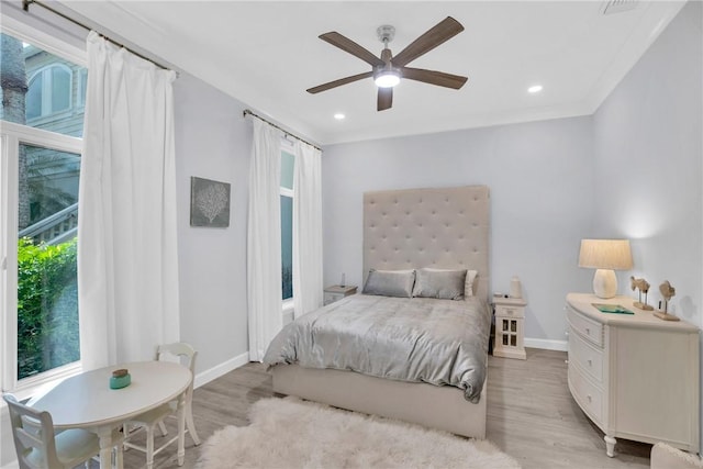 bedroom featuring light wood-style floors, ceiling fan, recessed lighting, and baseboards