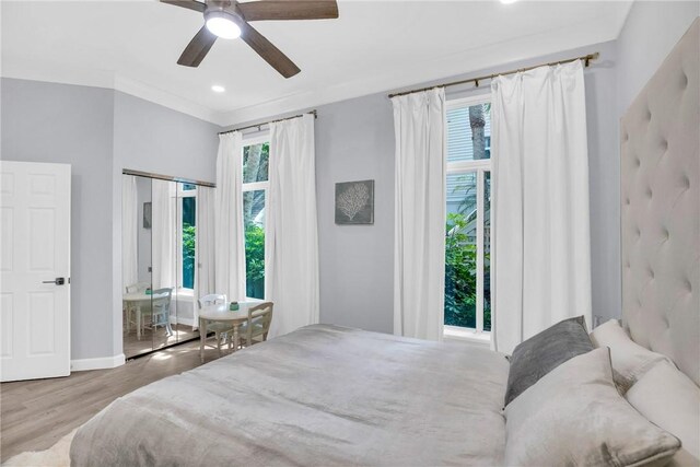 bedroom featuring recessed lighting, a ceiling fan, wood finished floors, and baseboards