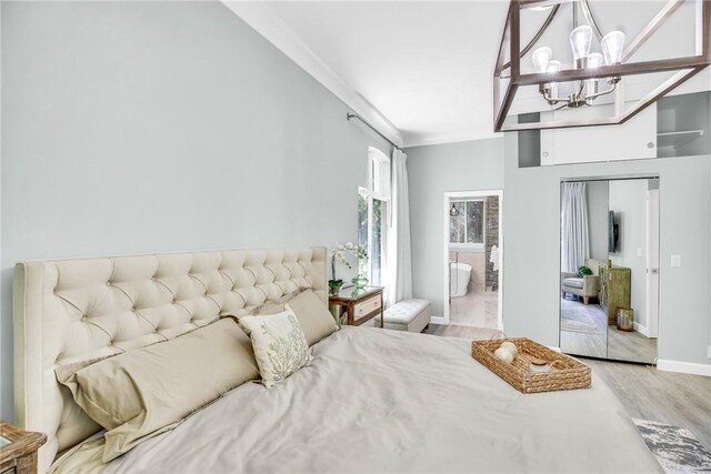 1255 Winding Oaks Cir E Unit 604, Vero Beach, FL 32963 - bedroom featuring a chandelier, light wood-style flooring, and ornamental molding