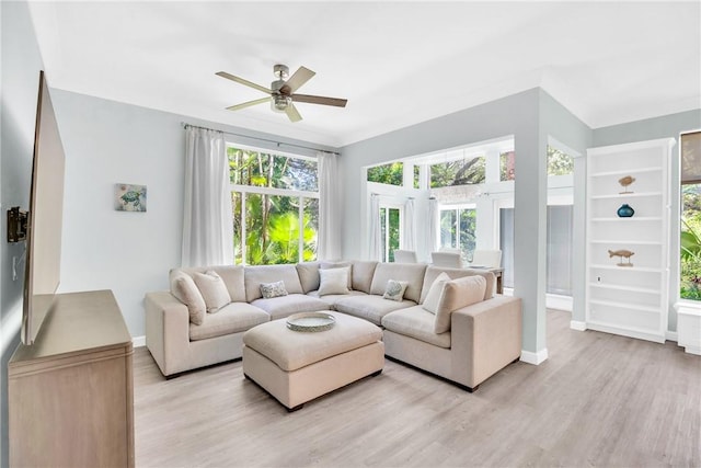 1255 Winding Oaks Cir E Unit 604, Vero Beach, FL 32963 - living room with a ceiling fan and light wood-type flooring