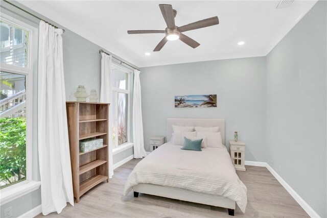 1255 Winding Oaks Cir E Unit 604, Vero Beach, FL 32963 - bedroom with light wood finished floors, ceiling fan, and recessed lighting