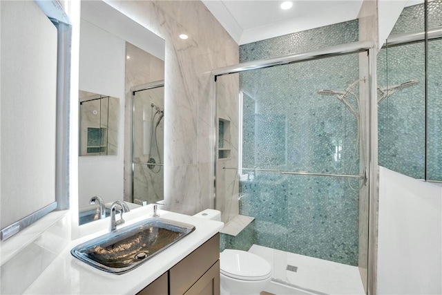full bathroom with toilet, vanity, a shower stall, and recessed lighting