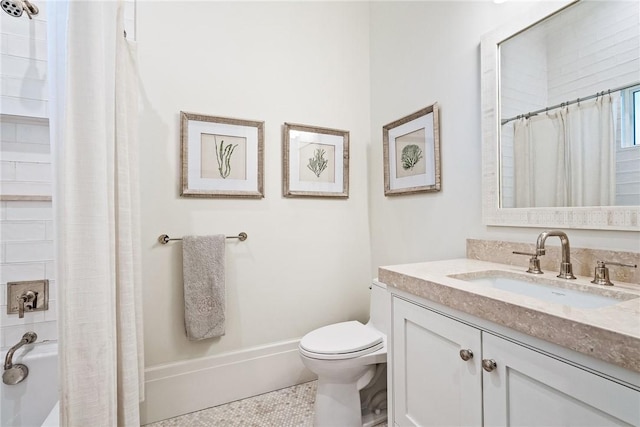 full bathroom with vanity, shower / tub combo, and toilet