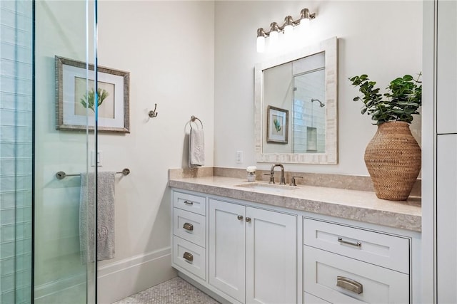 bathroom featuring vanity and a shower with shower door