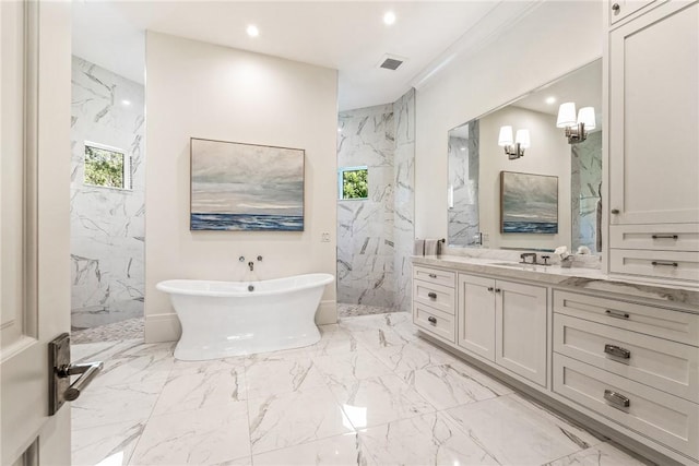 bathroom featuring vanity, a healthy amount of sunlight, and separate shower and tub