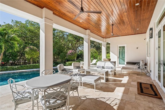 view of patio featuring ceiling fan