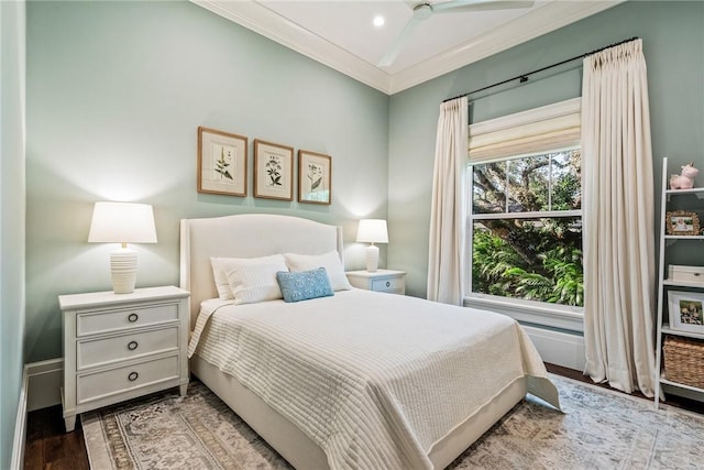 bedroom featuring crown molding and light hardwood / wood-style floors