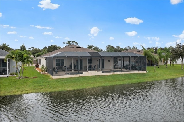 back of property featuring a patio, a water view, a lanai, and a yard