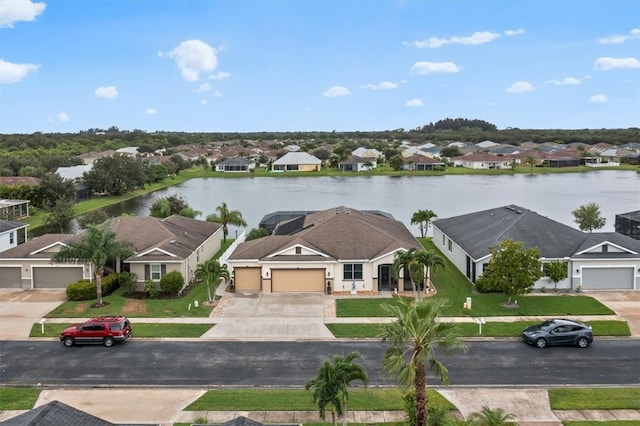 birds eye view of property with a water view