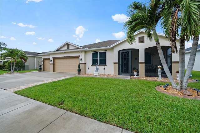 view of front of home featuring a front lawn and a garage