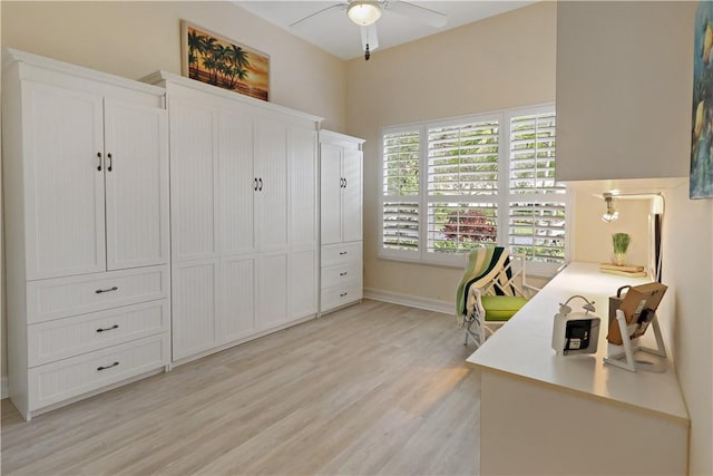 office area featuring ceiling fan, light wood-style flooring, and baseboards